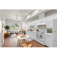 A white kitchen with a table and chairs.at Terracina Vista, Oregon, 97233-4299