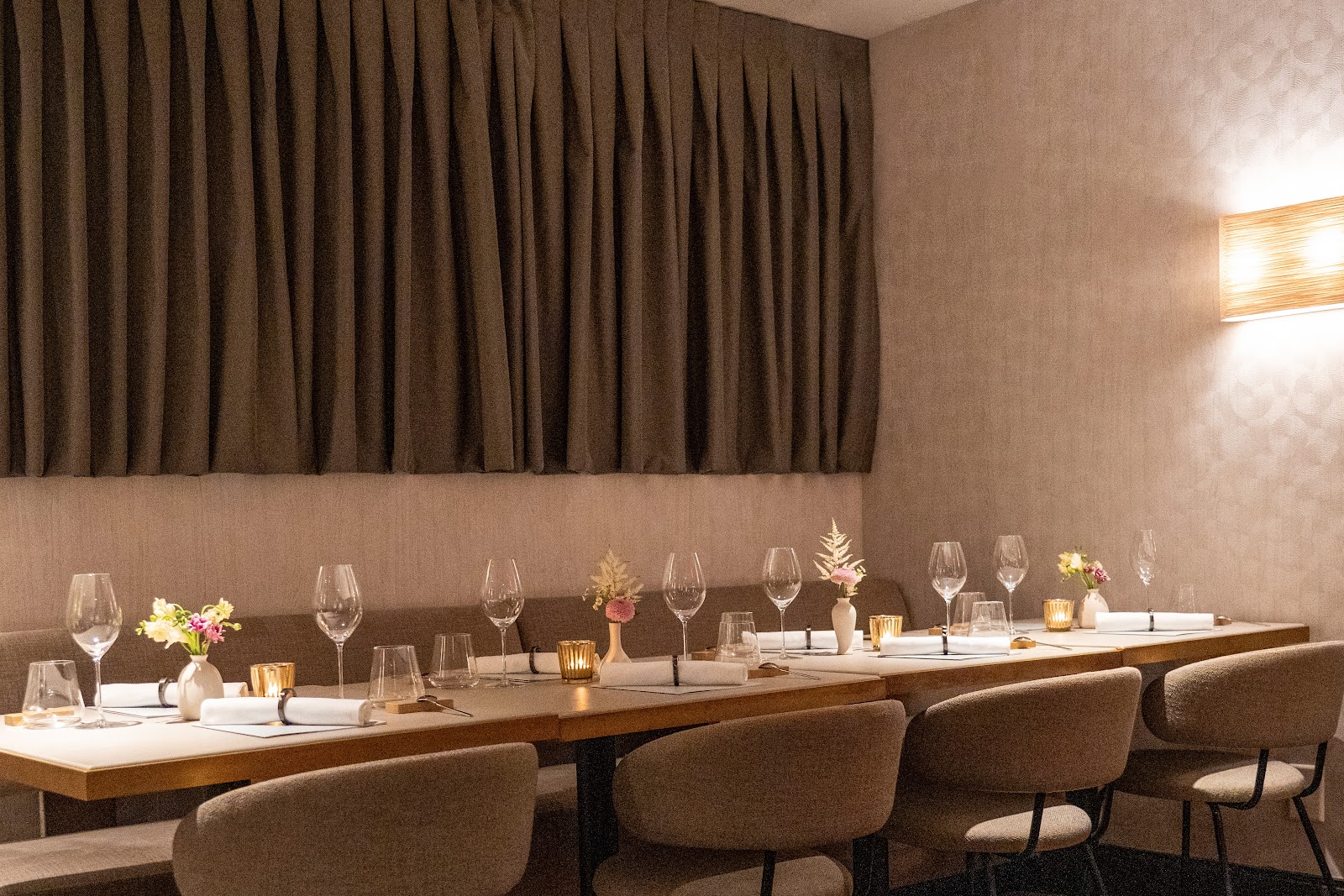 A table set with glasses at Essential by Christophe. In the dining room on Manhattan's Upper West Side.