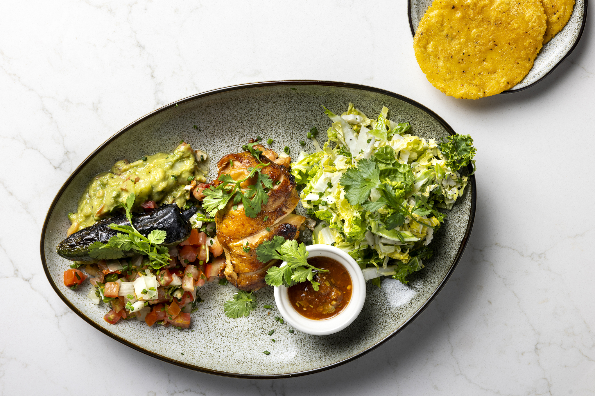 Grilled chicken taco platter with fresh toppings, house-made salsas, and bold coastal flavors in every bite