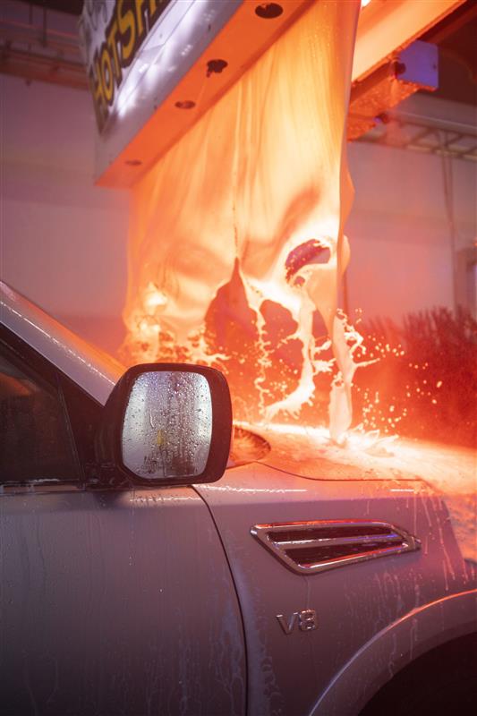 A car being immersed in a rich blanket of HotShine® Carnauba Wax