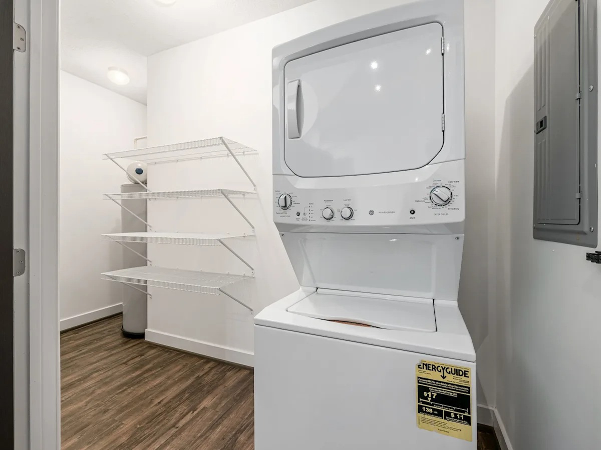 A white microwave oven with a sticker on it.