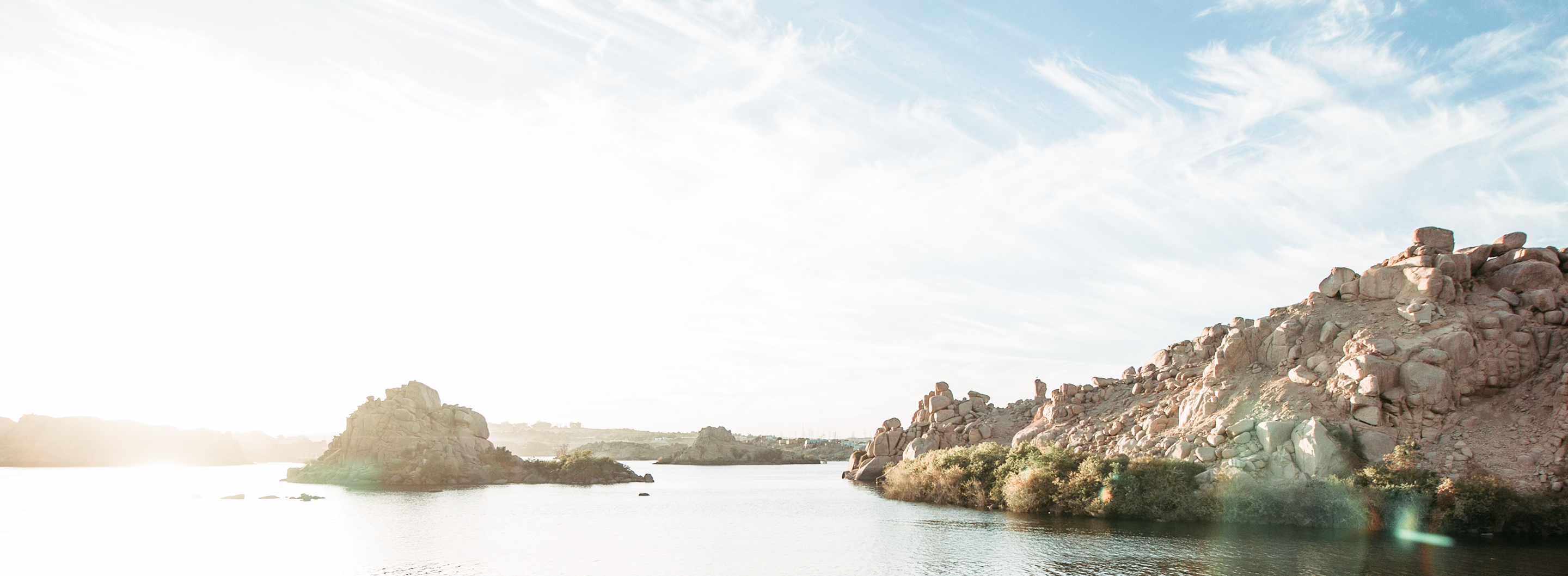 A scenic view of a rocky shoreline.