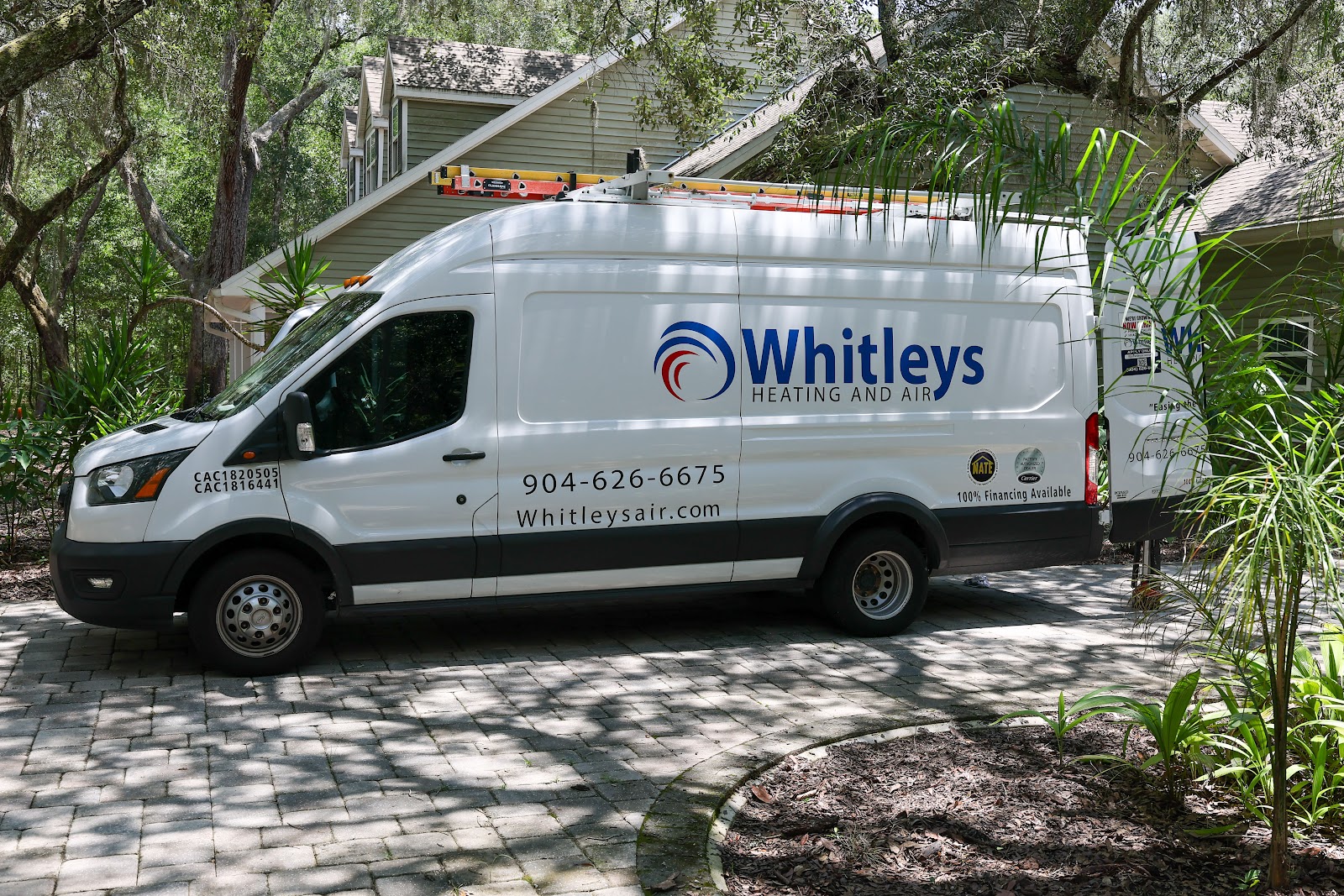 A white Ford Transit van with the 