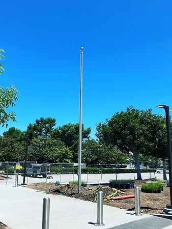 Burk Flagpole offers professional flag pole installation services to help you proudly display your flags. Our team is dedicated to ensuring your flag pole is securely and properly installed, adding a polished and professional touch to your property.