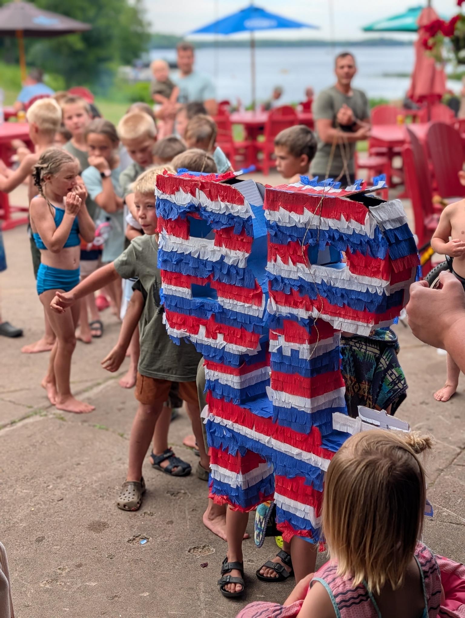 A company picnic isn't complete without a little fun! The kids had a blast taking turns at the piñata and enjoying a day filled with games, laughter, and great company.