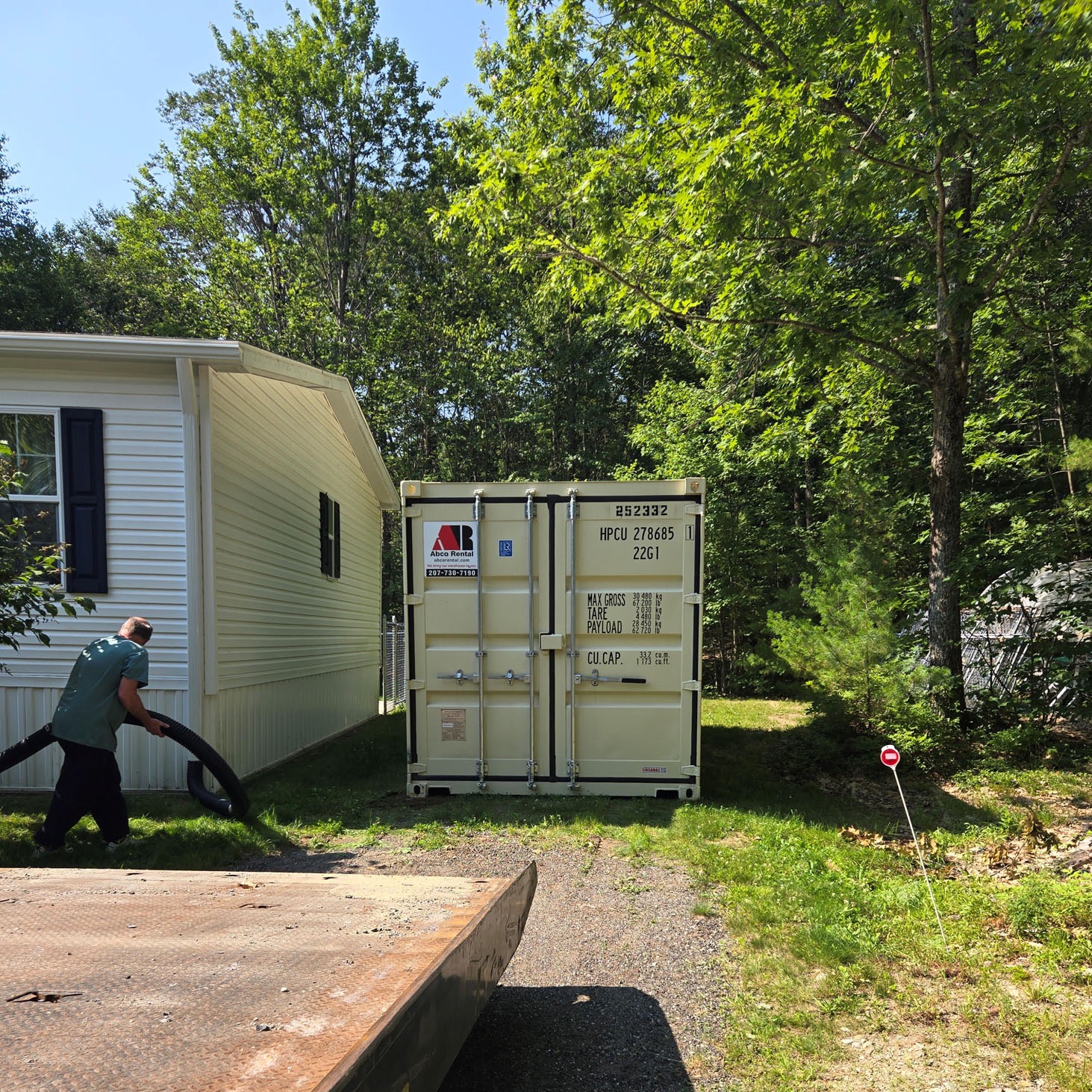 Abco Rental and Storage 20-foot shipping container delivered to a residential driveway in Gray, ME 