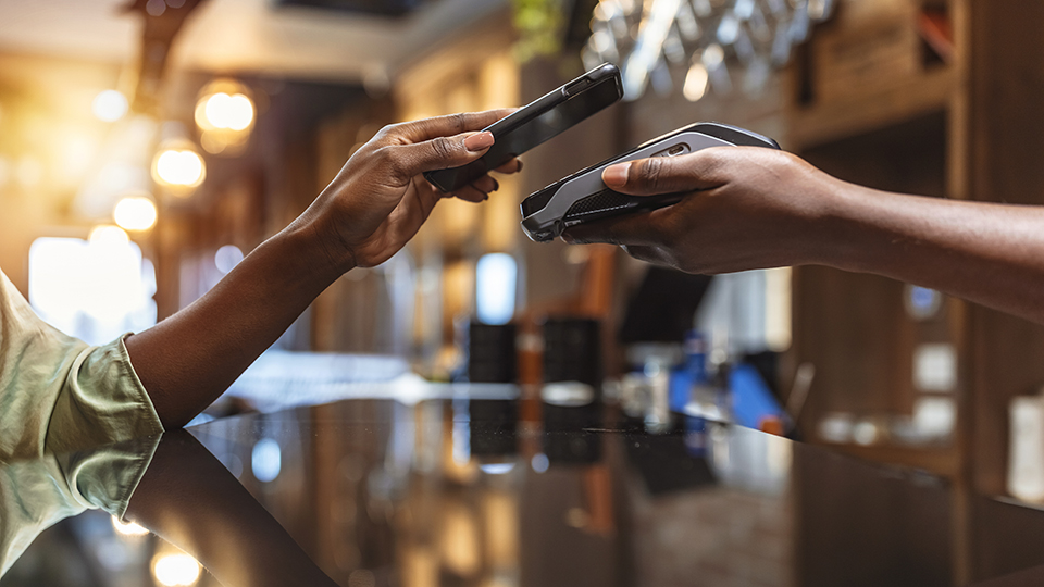 A person paying with a phone