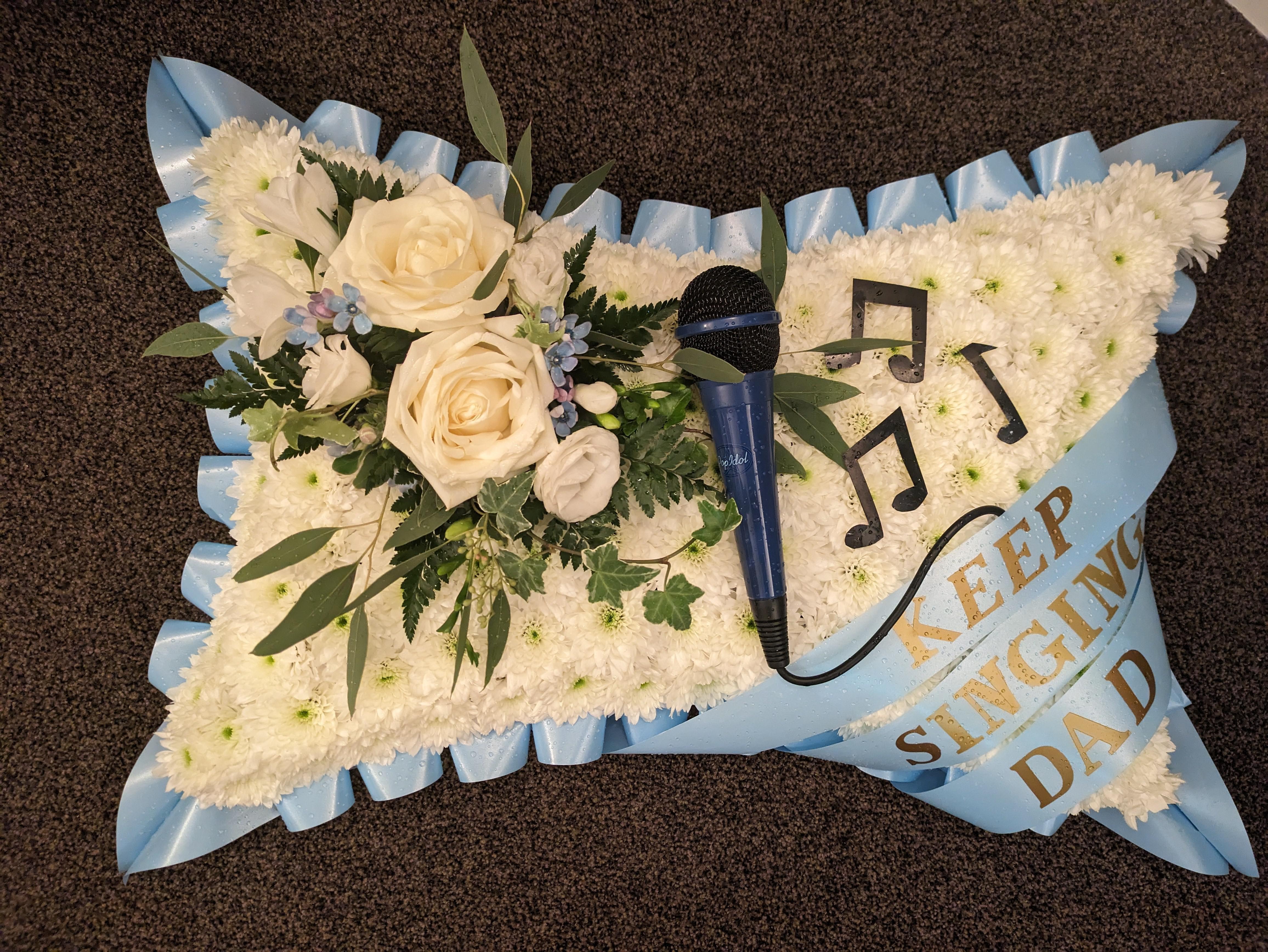 A bespoke floral arrangement for a singer Congleton Funeralcare Congleton 01260 270290