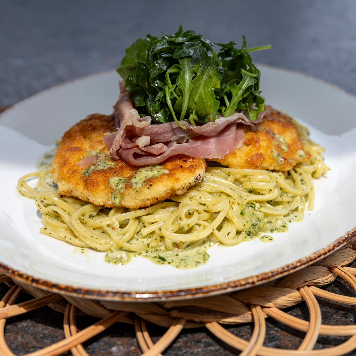 Chicken Pesto Bellagio | linguine, pesto & garlic butter sauce, prosciutto & arugula