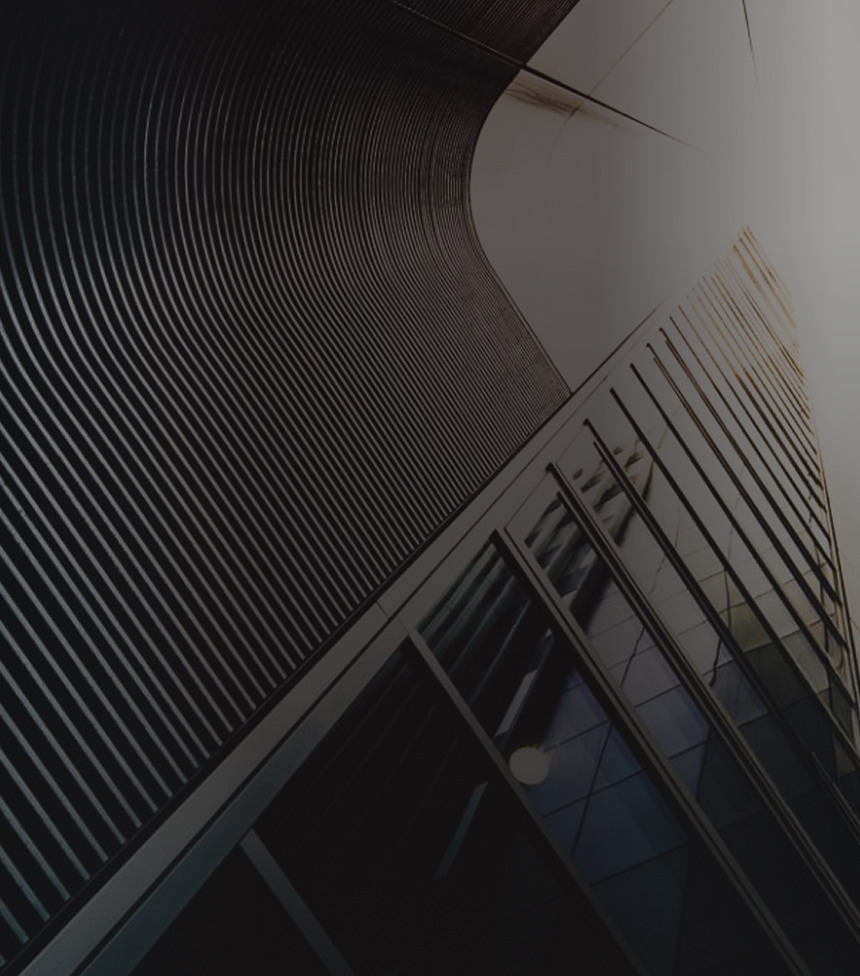 Close up, abstract view of a modern office building pictured from below.