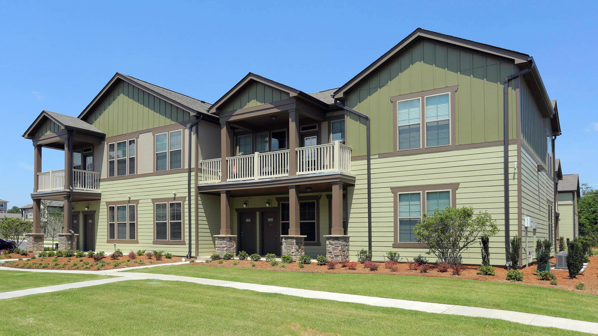 Exterior of The Aria at Woodlands South Apartment Homes