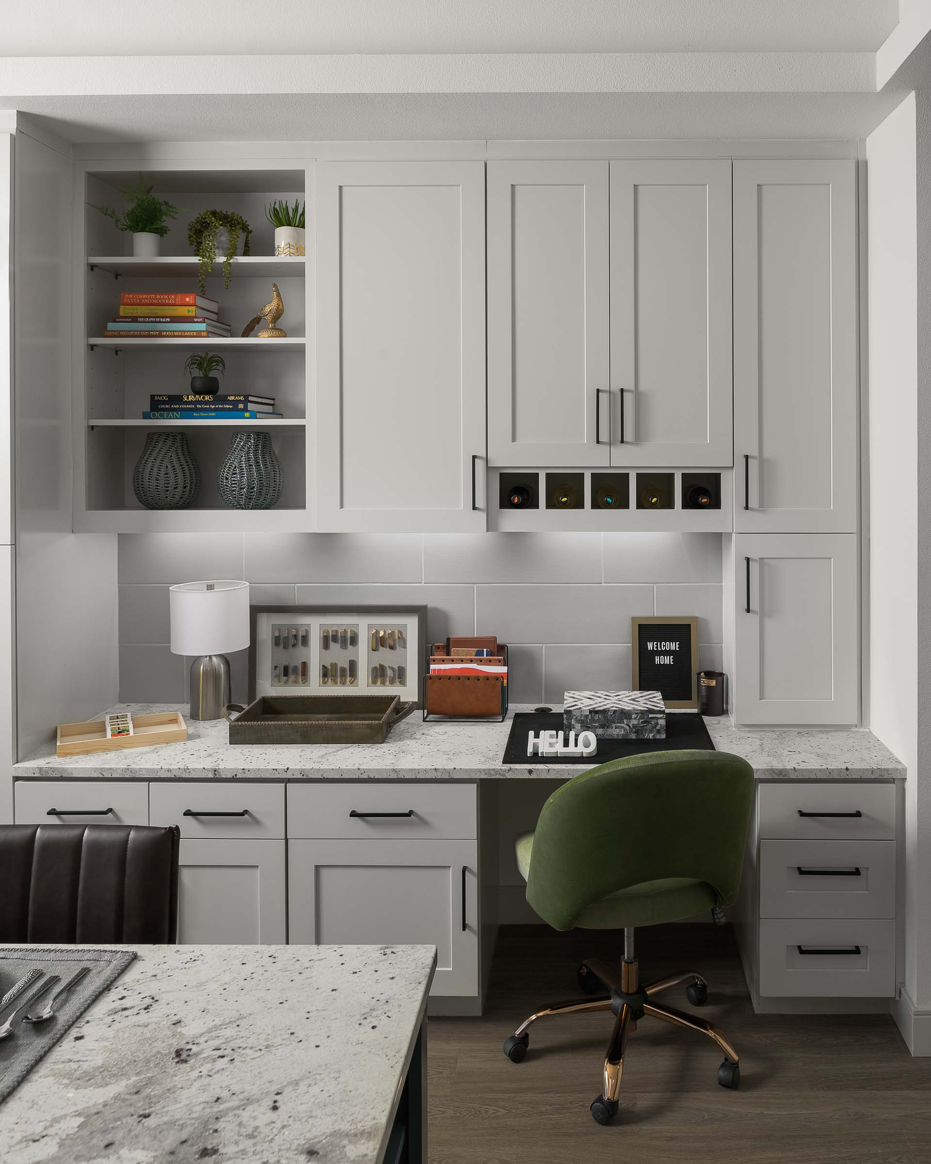 Built-in desk with storage cabinets and shelves at Camden Gilbert apartment homes in Gilbert, AZ