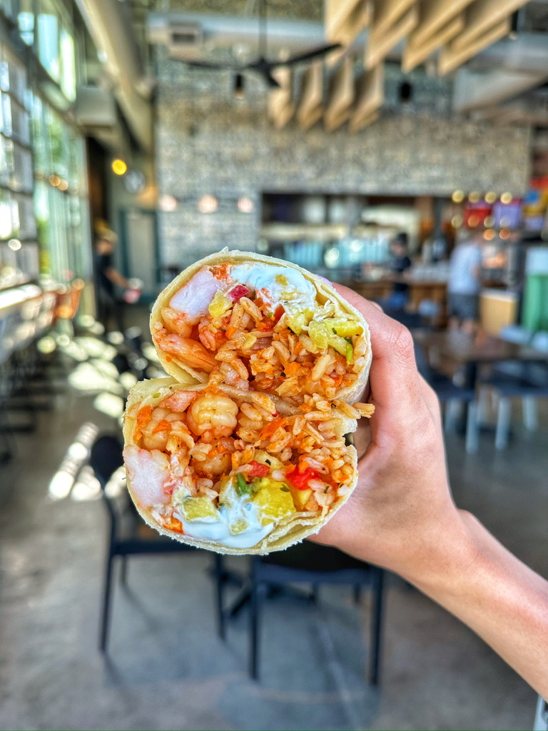 Baja costal vibes with this pineapple shrimp burrito filled with sauteed shrimp, rice, fresh pineapp 