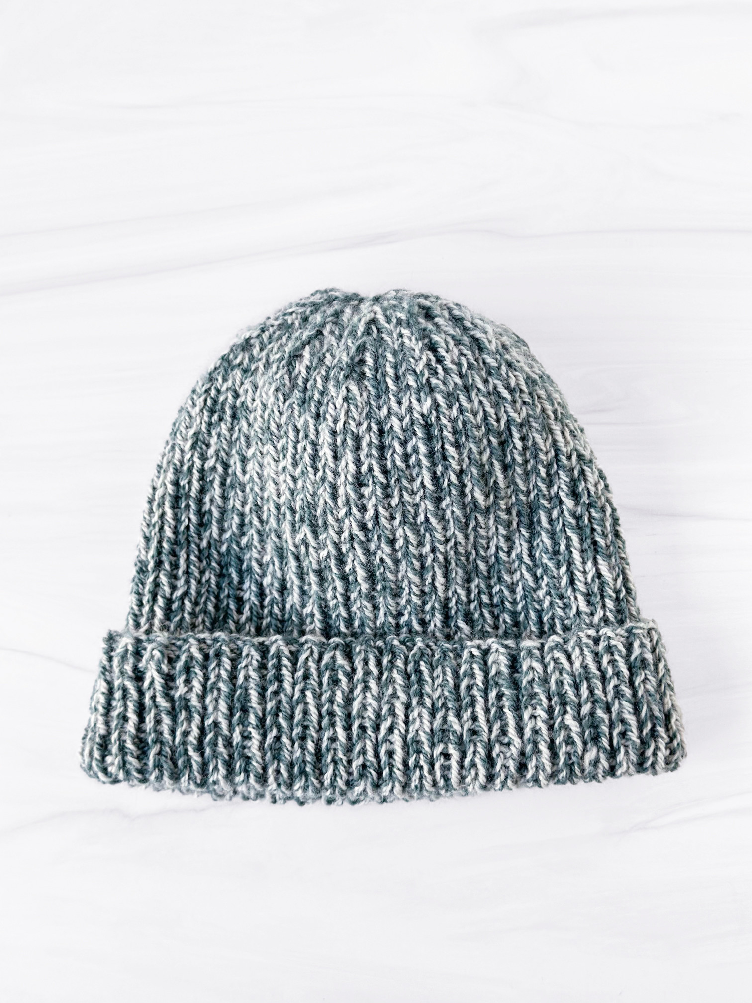 Get a taste of Woolfolk Tynd with our simple, cozy, and sublimely soft and squishy All Rib Hat!

For our sample, we held together 2 contrasting strands of Tynd (in colorways 13+31 held together). Not only did this hat fly off the needles, it created a lovely marled effect that's great for everyday wear!