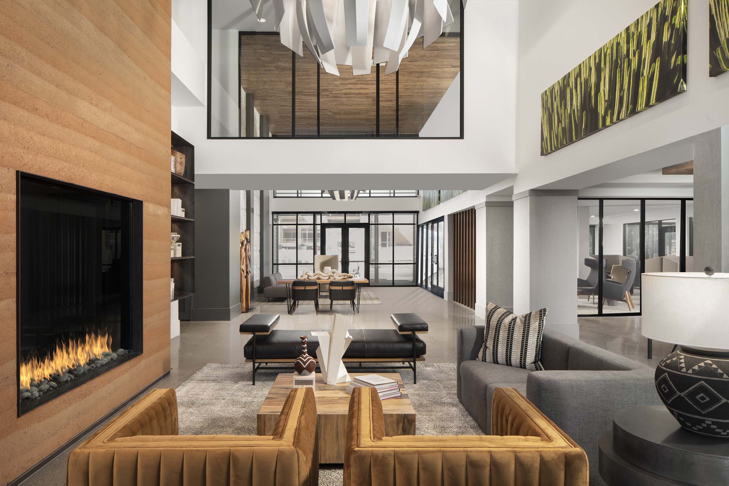 Double height resident lounge with fireplace and seating