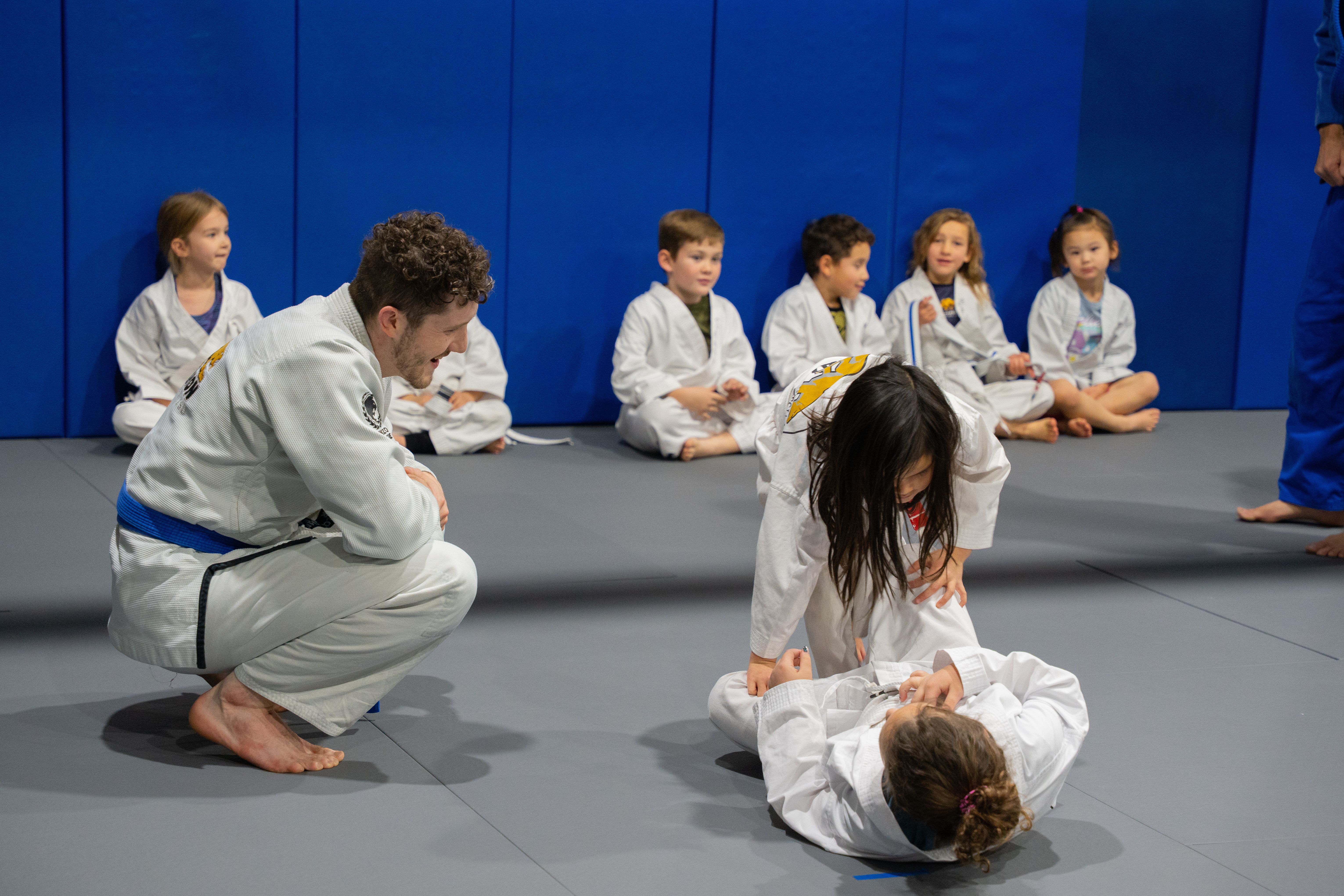 Learning starts with guidance. At McMahon Training Center, our young athletes build confidence, discipline, and technique through hands‑on coaching and focused practice. With instructors who stay engaged every step of the way, kids develop real skills in a safe, supportive environment where growth happens on and off the mats.