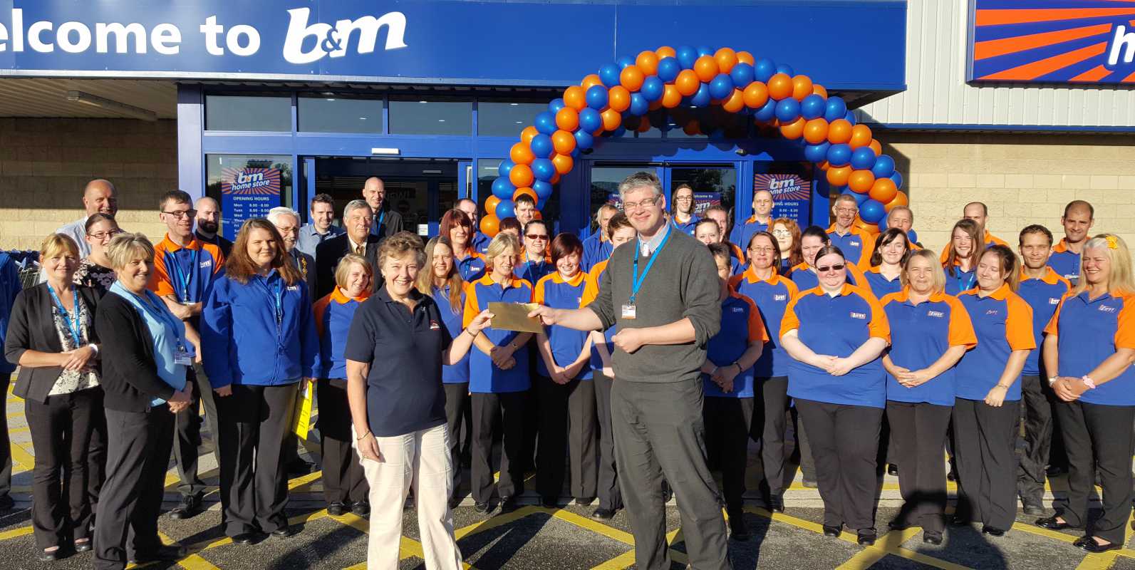 B&M's Local Hero for the opening of B&M Penzance, the RNLI Penlee Lifeboats, gratefully receiving £250 worth of B&M vouchers.
