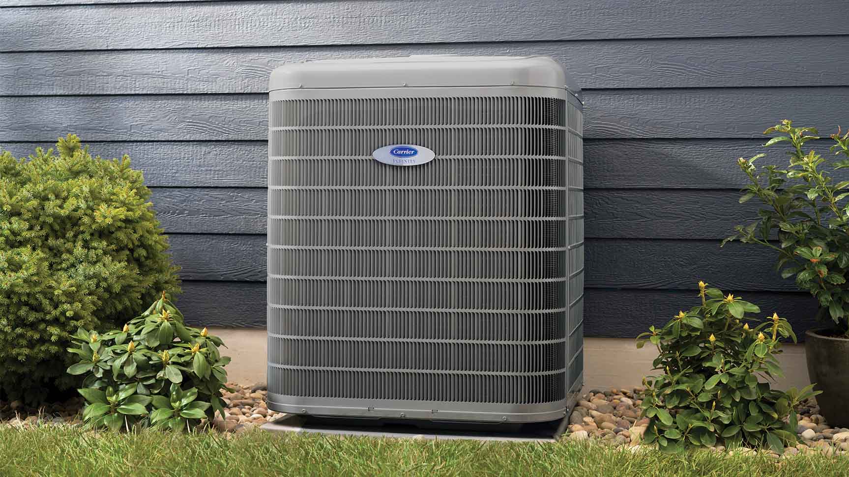 A Carrier Infinity air conditioner installed outside a home