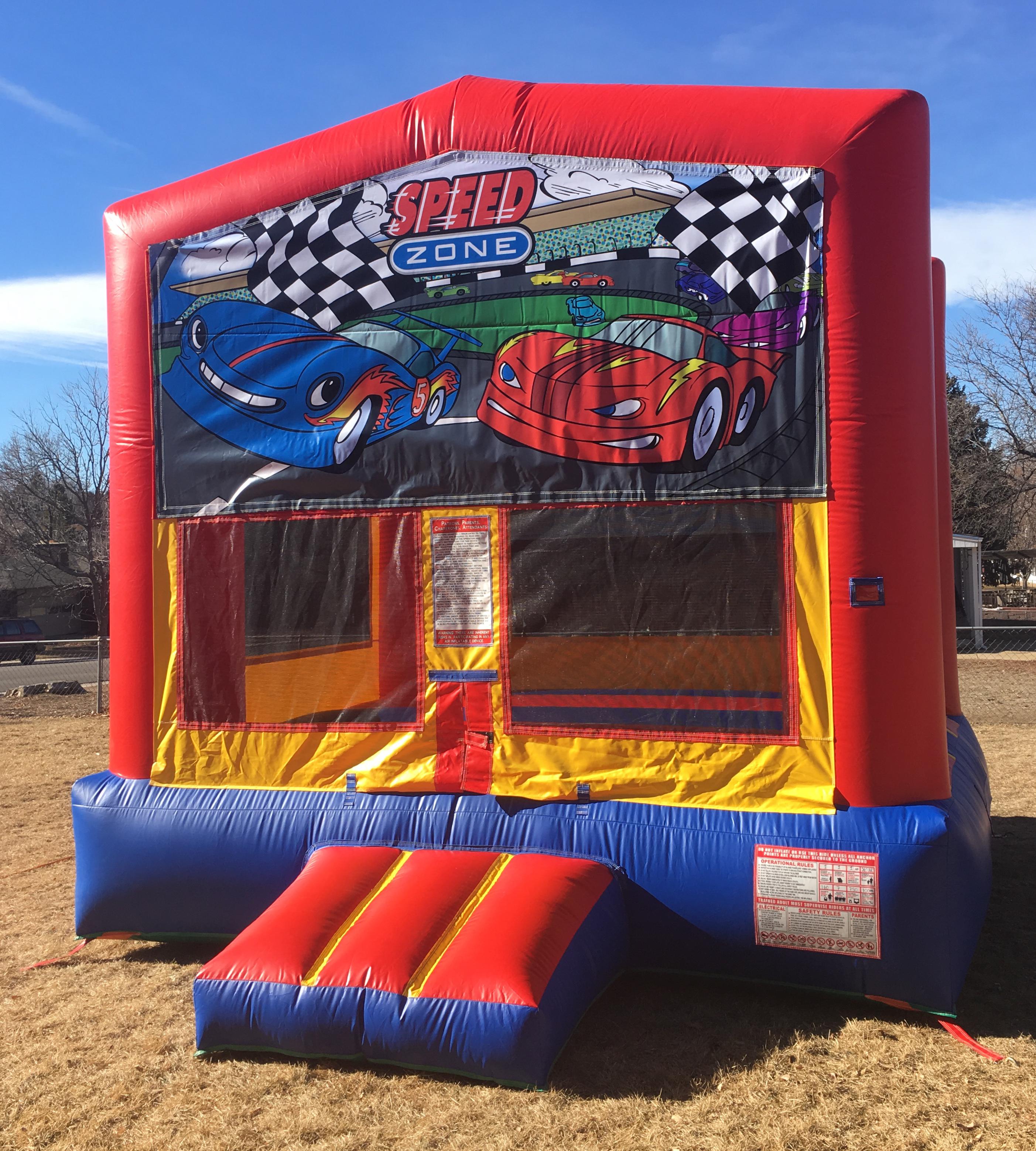The big house, bouncy castle with race, car theme.