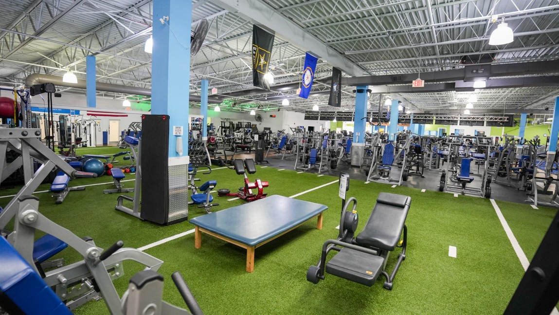 Functional and performance training area at Everyone Fitness Rehoboth Beach featuring turf, benches, and strength gear.