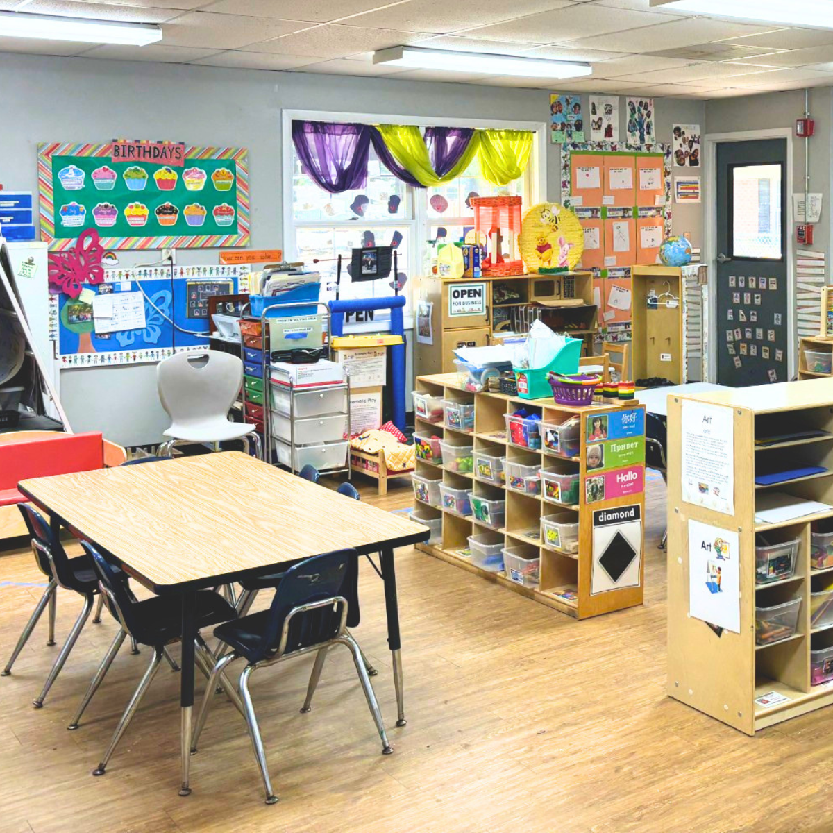 Bright and colorful preschool classroom at Childcare Network with age-appropriate learning materials