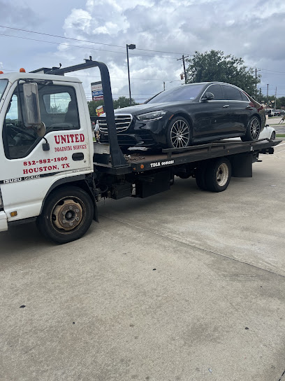 United Roadside Service safely transports a black luxury sedan on a flatbed tow truck, providing secure loading, careful vehicle handling, dependable towing, reliable transportation, and premium roadside assistance throughout Houston.