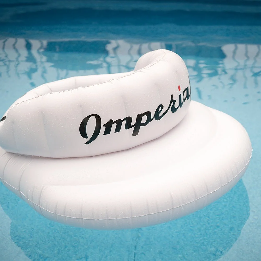 The Tour Visor&reg; Pool Float on the water, beaded with droplets.